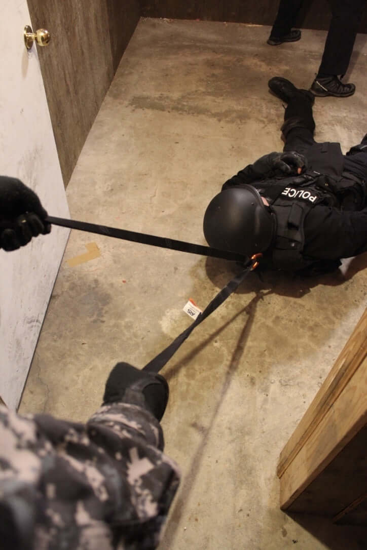 Multi-Loop Rescue Strap pulling person out of doorframe