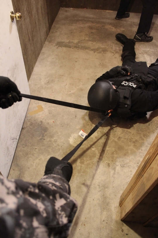 Multi-Loop Rescue Strap pulling person out of doorframe