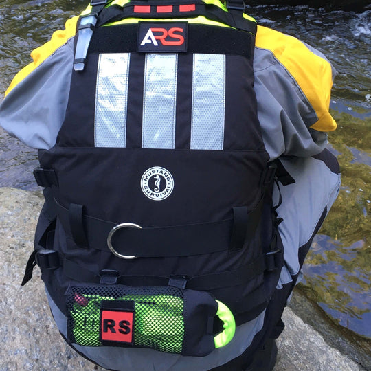 Volunteer wearing the Water Ops Rapid Deployment Bag on lifejacket