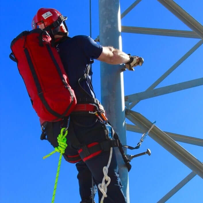 Rescuer climbing with Anderson Rescue Solutions Breakout Rope Bag