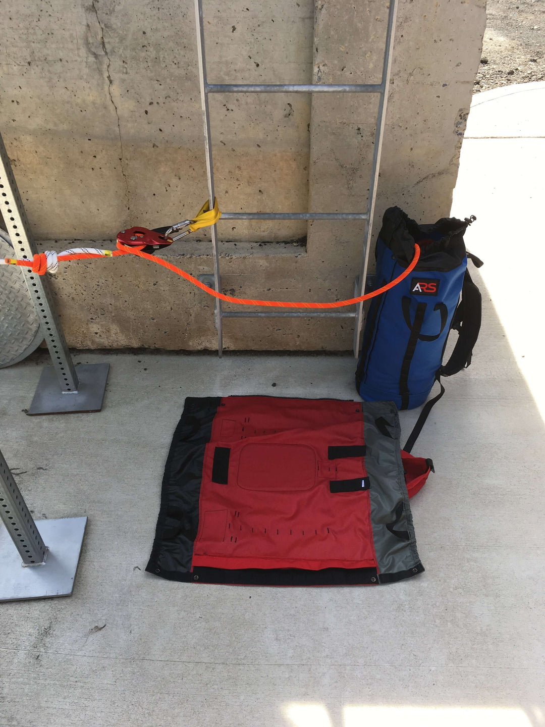 Red Anderson Rescue Solutions Breakout Rope Bag under ladder